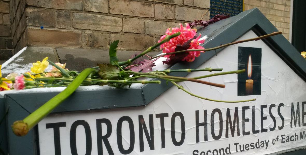 A sign written with "Toronto Homeless Memorial" outside a Toronto church